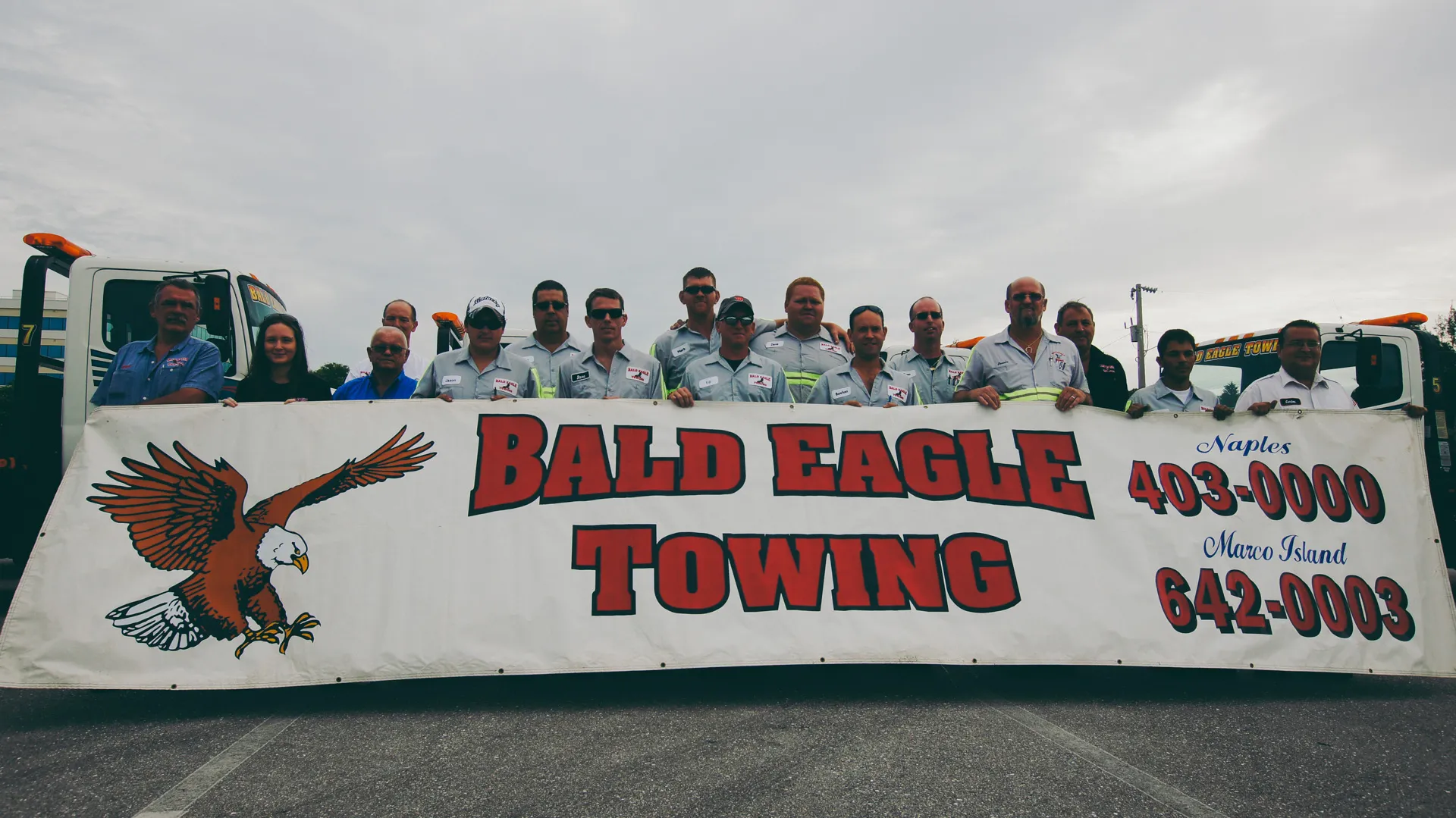 A throwback picture of the original owner, Bud Gruber, and his team outside the shop.  